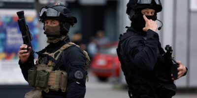 TOPSHOT - Officers from the RAID ("Research, Assistance, Intervention, Deterrence") tactical unit of the French National Police patrol the street in Lille, northern France, on June 30, 2023, as unrest erupted following the shooting of a teenage driver by French police in a Paris suburb on June 27. The death of 17 year-old Nahel M. on June 27, 2023, sparking major unrest across France, has reignited debate in France about police tactics long criticised by rights groups over the treatment of people in low-income suburbs, particularly ethnic minorities. (Photo by KENZO TRIBOUILLARD / AFP)